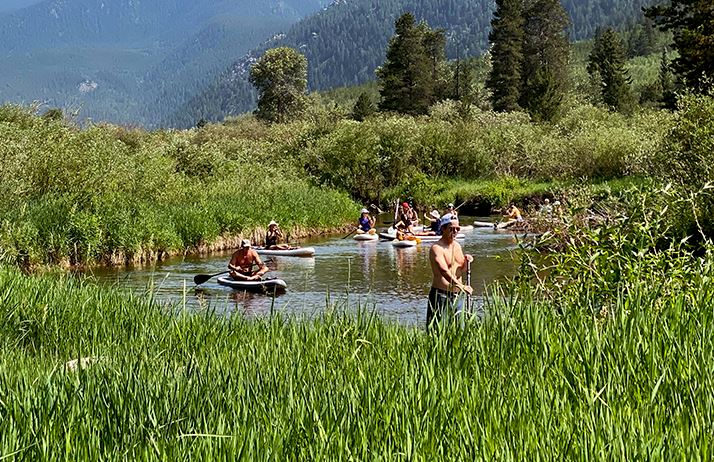 Paddleboarders on the river at North Star Nature Preserve.