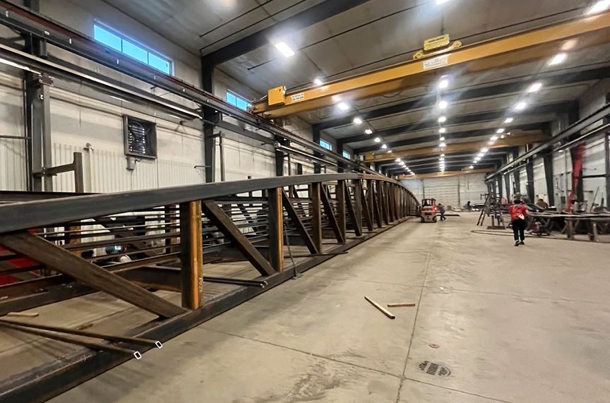 Offsite fabrication of the bridge that will connect  Aspen Village and the Rio Grande Trail 