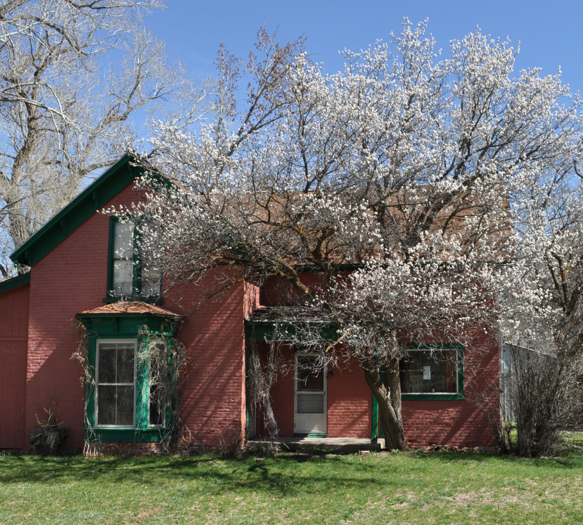 Glassier Ranch Farmhouse is two stories and constructed of redbrick